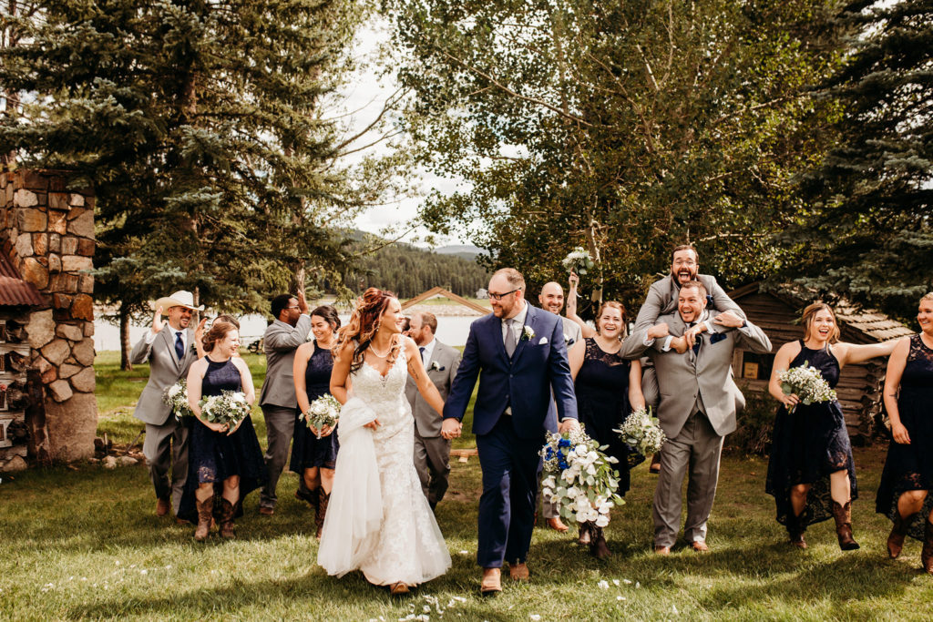 Yvonne and Ken celebrating their marriage with their wedding party.