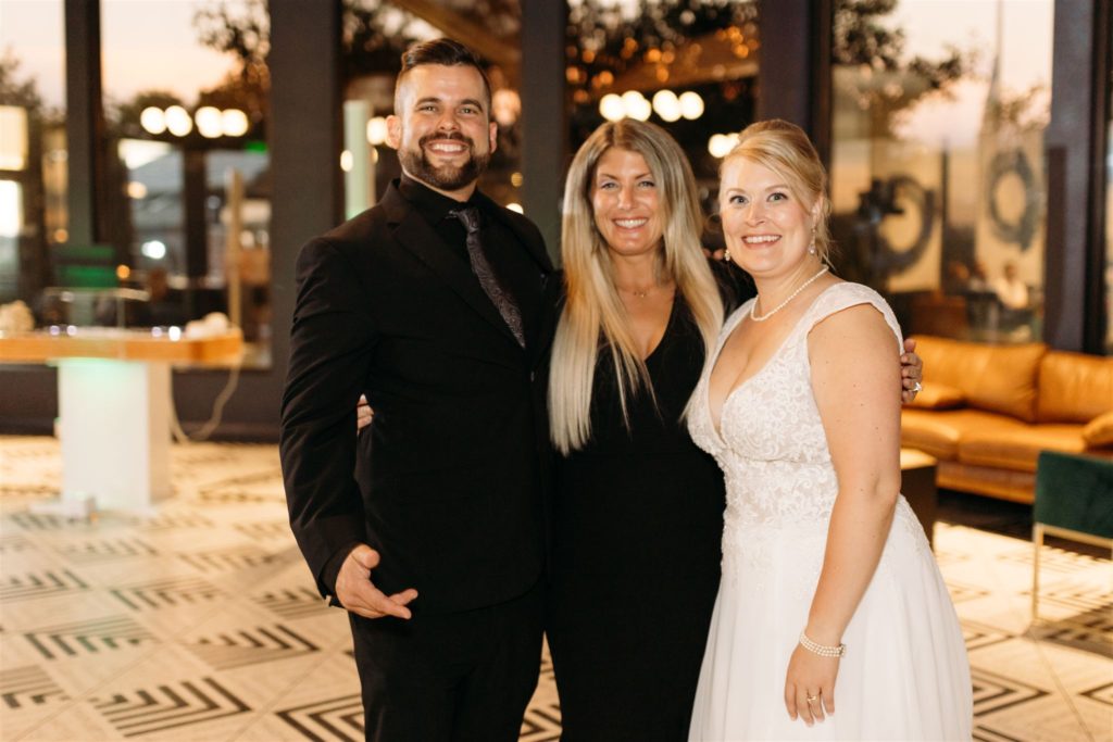 Justin and Lesley pose with wedding client Carlene.