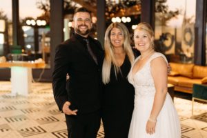 Justin and Lesley pose with wedding client Carlene.
