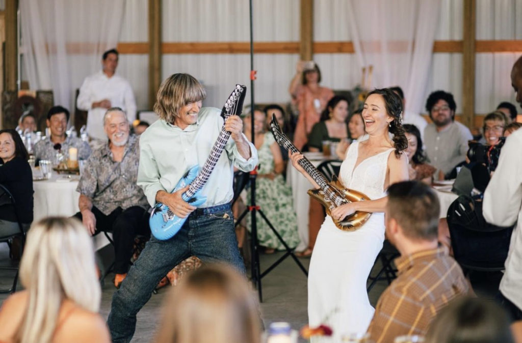 Dana and her dad Gene playing air guitar during the father daughter dance.