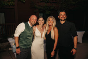 Lesley and Justin Kada posing with wedding clients Elizabeth and Jeff.
